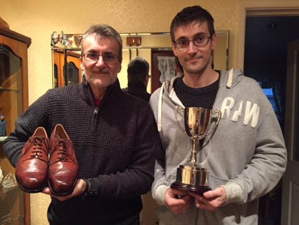 Chris Thorne from Bill Bird Shoes (r) with his trophy alongside his dad Mick, who is holding the winning shoes.